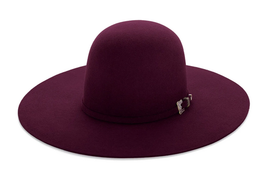 A ruby red felt hat with an open crown and a flat brim, displayed against a plain background.